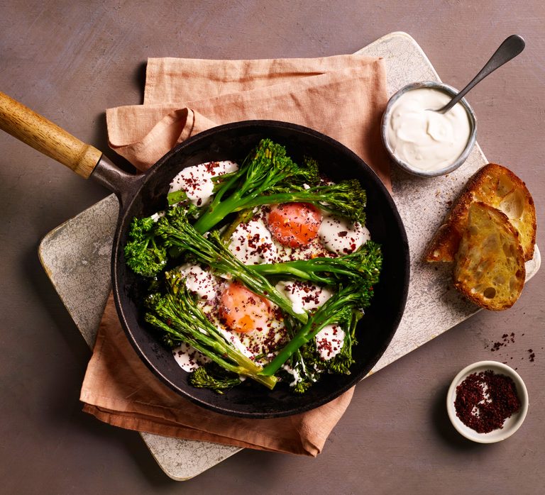 Baked eggs with sumac, long-stem broccoli and tahini yogurt